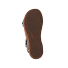 The sole of a Taos Women's Wonderful Dark Blue sandal with a leaf-patterned tread and the orange TAOS logo, viewed from below.