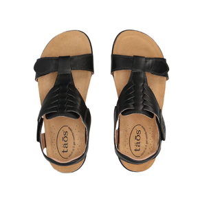 TAOS Women's Wonderful Black sandals with Italian leather uppers and tan footbeds, viewed from above.