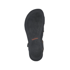 The TAOS Women's Big Time Black sandal features a textured sole, SOFT SUPPORT footbed, and orange logo near the heel.