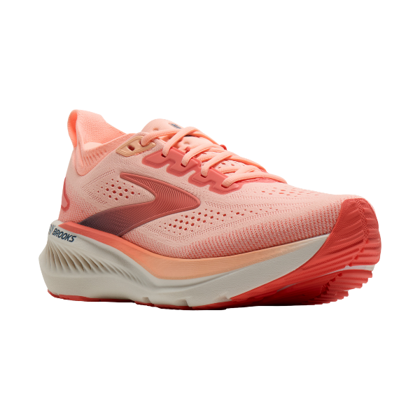The Brooks Women’s Glycerin GTS 23 in Coral/Peach features a vibrant mesh upper and cushioned white sole.