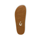 Brown sandal sole with leaf-patterned treads, white OLUKAI logo; Olukai Women's Kipea Pono Tapa slide sandals.