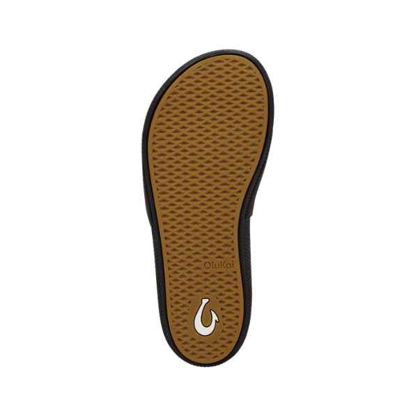 OLUKAI Women's Ulele Slide Black: Textured brown sole, black border, logo & water-ready comfort.