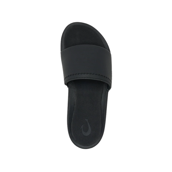 Top view of the OLUKAI Women's Ulele Slide Black, a water-ready sandal with wide strap and supportive footbed.