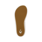 The Olukai Women's Ulele Slide White has a brown textured sole and supportive footbed with a white OLUKAI logo.