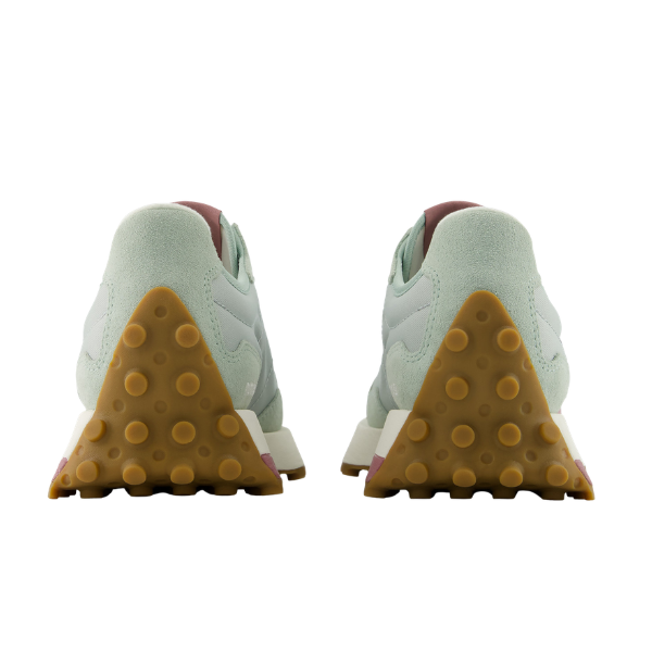 Back view of New Balance Women's 327 Green/Rose sneakers with gum soles, raised circular grips, and white midsoles.