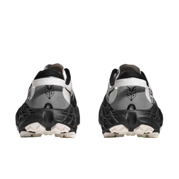 HOKA Women's Speedgoat 7 Wide running shoes in black, white, and gray shown from the back on a white background.