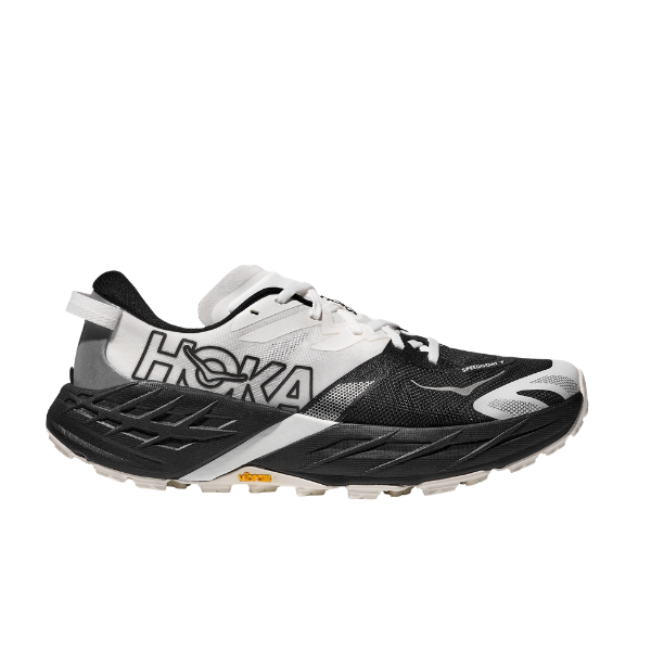 HOKA Women's Speedgoat 7 Wide trail running shoes in black and white with a thick sole and HOKA branding on the side.