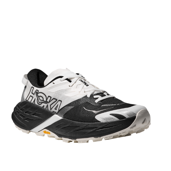 HOKA Women's Speedgoat 7 Wide in black and white, features thick sole, side logo, and rugged tread (angled view).