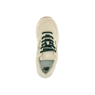 Top view of New Balance Women's 574 Tan sneaker with dark green laces and logo, ideal for versatile women’s style.