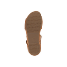 Dansko Women's Tinsley Natural sandal seen from below, displaying its tan rubber sole with a wavy tread pattern.