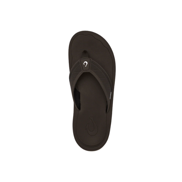 A single OLUKAI Men's Ahi Kai Dark Java flip-flop sandal with a wet grip outsole, shown from above.