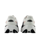 Rear view of New Balance Men's Rebel V5 White/Flame shoes with FuelCell midsole and NB heel logos.