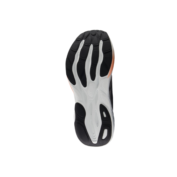 The outsole of the New Balance Women's 880 V15 White/Orange has a black and white wavy pattern with textured grip.