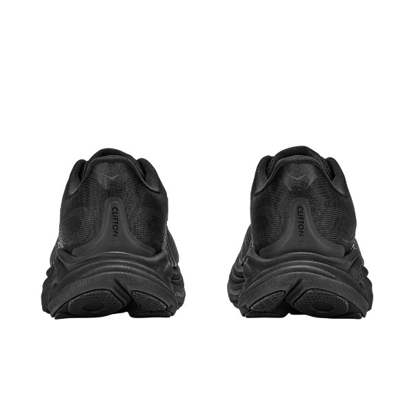 Rear view of HOKA Women's Clifton 11 Black/Black running shoes placed side by side on a white background.