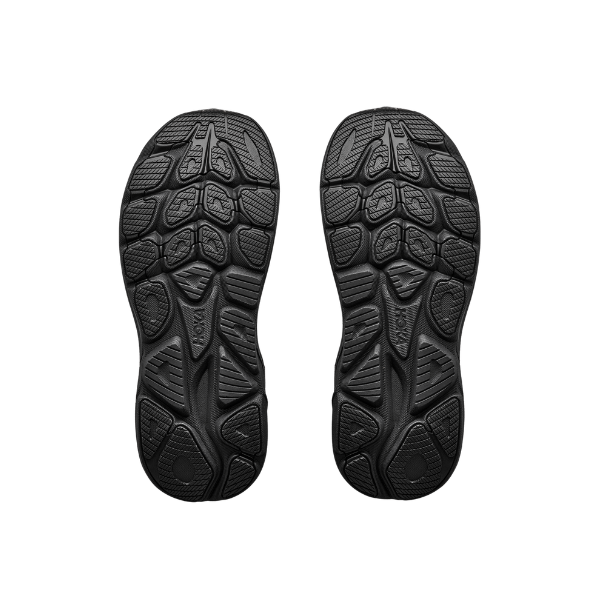 A pair of HOKA Women's Clifton 11 Black/Black running shoes with cushioned, textured soles on a white background.