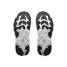 The soles of HOKA Women's Clifton 11 Black/White running shoes feature textured grips, shown from the bottom.