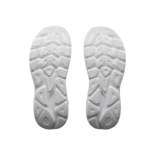 The white soles of HOKA Women's Clifton 11 feature geometric tread—perfect cushioning for running.