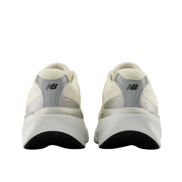 Pair of New Balance Women's 860V15 Yellow/White shoes viewed from the back, showcasing heels and black tread.