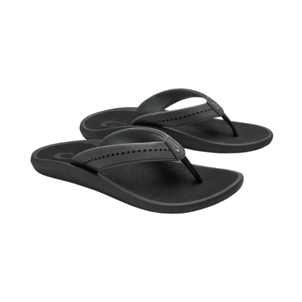 OLUKAI Women’s Ulele Black thong sandals with a supportive footbed and minimalist design on a white background.