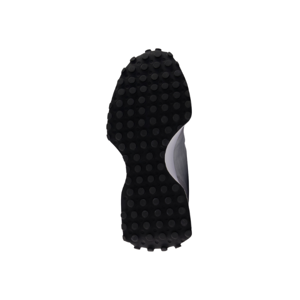 The black rubber sole of a NEW BALANCE Women’s 327 Rain/White sneaker, made for comfort, shown from the bottom.