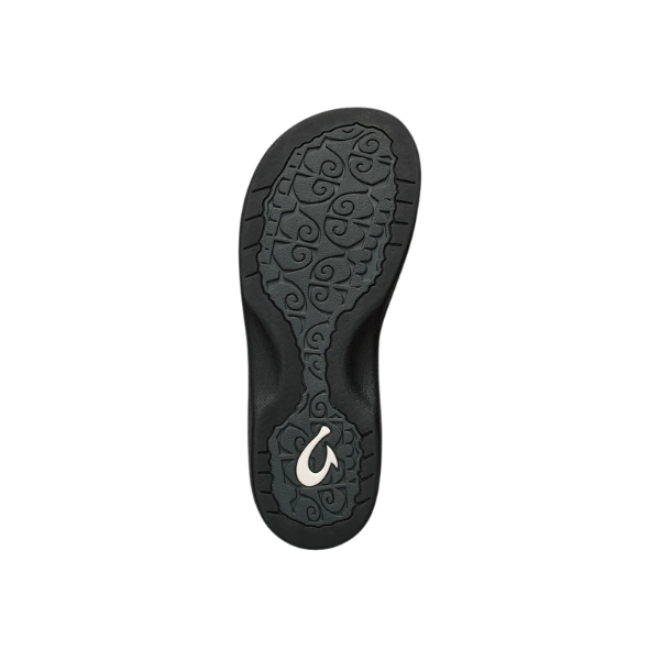 OLUKAI Women’s Ohana Lahi Black/Black: comfy, water-resistant beach sandals with swirl-patterned black sole and white logo.