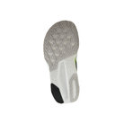 The NEW BALANCE FuelCell Rebel v5 Wide Green/Grey has a mostly white sole with black, green, and geometric tread.