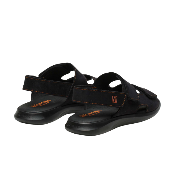 The ARCOPEDICO Arcopedico Womens Sumava Sandal in black features adjustable hook-and-loop closures, orange stitching, contoured soles for foot pain relief, and a subtle orange logo. Shown from the back and side on a plain background.