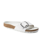 The Birkenstock Womens Madrid Big Buckle White sandal by BIRKENSTOCK features natural white leather, a large silver buckle, a brown cork sole, and a textured white footbed, shown on a white background.