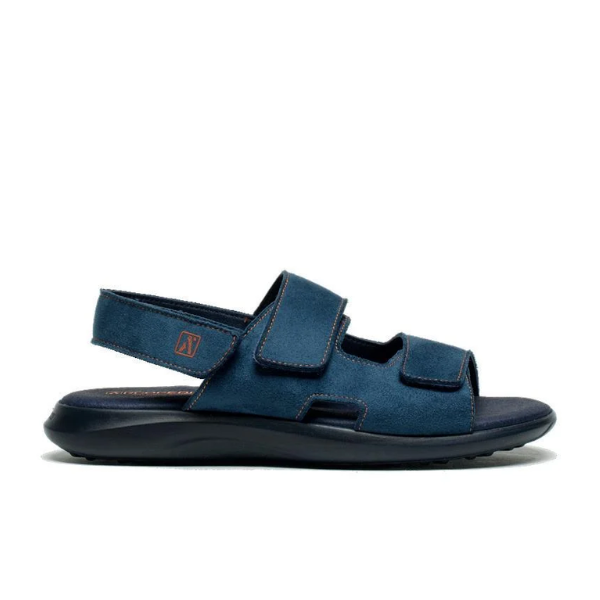 The ARCOPEDICO Arcopedico Womens Sumava Sandal Blue features two adjustable hook-and-loop straps across the top, one at the heel, a black cushioned sole for foot pain relief, and contrast stitching, shown on a white background.