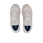 Top view of New Balance Womens 574 Core sneakers in white and grey, featuring mesh toe boxes, white laces, and dark blue insoles. A versatile NEW BALANCE shoe displayed on a plain white background.