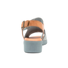 A back view of the Django & Juliette Womens Madis Steel Leather Gray/Tan sandal by DJANGO & JULIETT, featuring a thick light blue sole, tan adjustable ankle strap, and cushioned insole, shown on a white background.