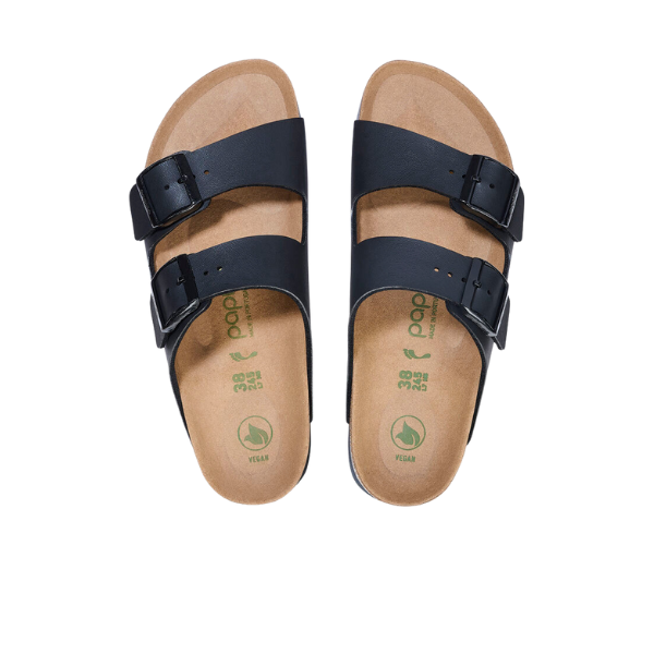 The Birkenstock Womens Arizona Flex Platform Black sandals feature double straps with adjustable metal buckles, tan footbeds, green vegan symbols on the insoles, and are crafted from vegan materials.