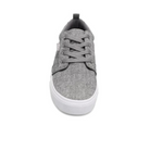 The RIVAL, INC. Rival Womens Tilt Grey Chambray is a front-view gray canvas sneaker with gray laces, a black heel pull tab, and a white abrasion-resistant rubber outsole, shown against a white background.
