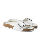 The Birkenstock Womens Madrid Big Buckle White sandals feature large silver buckles, a textured strap, cork soles, and white outsoles.