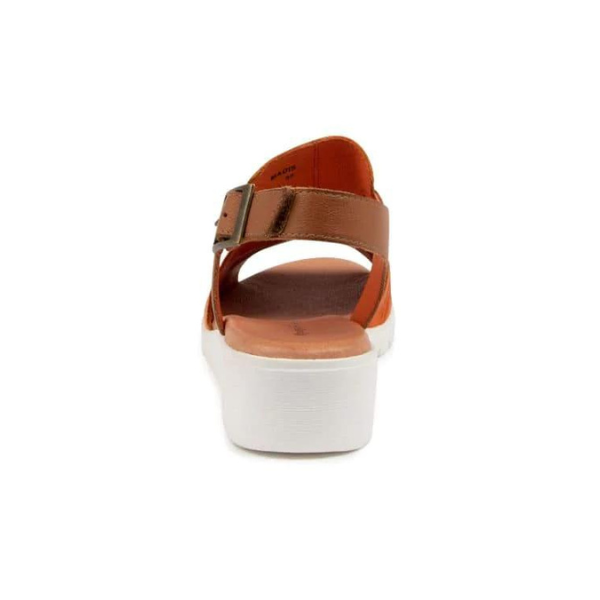 The DJANGO & JULIETT Womens Madis sandal in orange/dark tan leather features a thick white sole, ankle strap, and buckle for comfort, shown from the back against a plain white background.