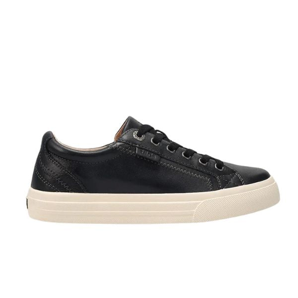The Taos Womens Plim Soul Lux Black by TAOS is a black low-top sneaker with black laces, a white rubber sole, subtle stitching, and metatarsal support, shown in a side view against a white background.