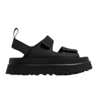 The UGG Womens Goldenglow Sandals Black feature a chunky, ridged platform sole, open toe, and three adjustable straps—ideal for fans of stylish UGG sandals.