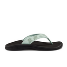 The OLUKAI Womens Ohana Mint / Swell Hua sandal features a mint green tropical-patterned strap and a black anatomical cushioned sole, shown in side profile against a white background.