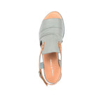 Top view of the Django & Juliette Womens Madis Steel Leather sandal in gray/tan with a buckle ankle strap, tan insole, visible stitching, and a slightly raised heel for comfort. Brand: DJANGO & JULIETT.