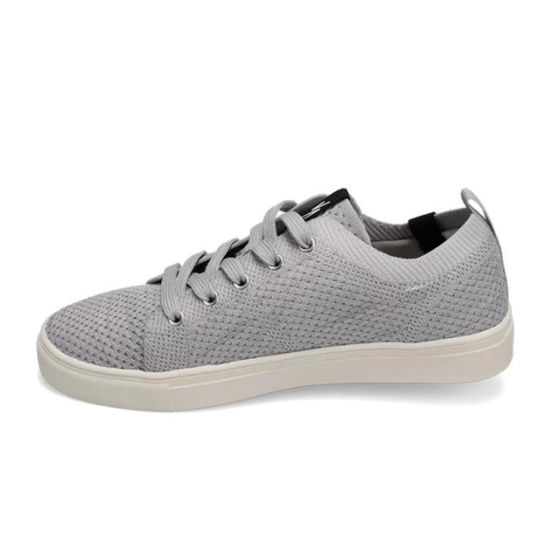 The Rival Womens Ace Knit Light Grey by RIVAL, INC. is a light gray low-top sneaker with gray laces and a white, abrasion-resistant outsole, displayed from the side against a white background.