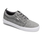 The Rival Womens Tilt Grey Chambray by RIVAL, INC. is a grey casual canvas sneaker with a white sole, abrasion-resistant rubber outsole, grey laces, and a small branded tag on the side, displayed against a white background.