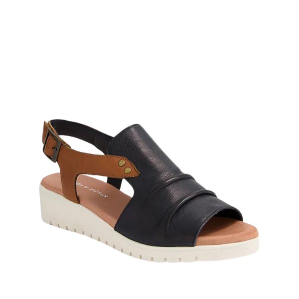 The DJANGO & JULIETTE Womens Madis sandal features navy and tan leather with an open toe, cushioned footbed, ruched upper, and supportive wedge sole for stylish comfort and all-day foot pain relief.