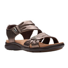 The CLARKS Womens Kitly Ave Bronze sandal offers a Contour Cushion footbed, adjustable straps, open toe, and black rubber sole—combining comfort and style in a chic metallic bronze finish for casual wear.