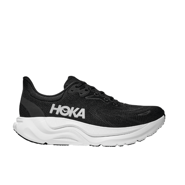 The HOKA Womens Arahi 8 Wide in Black/White features exceptional stability and a thick, cushioned white sole, shown from the side on a white background.