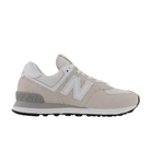 The New Balance Womens 574 Core White/Grey features a mesh and suede upper, white laces, distinctive N branding, and a gray heel accent for versatile style and classic comfort.
