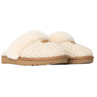 UGG Women's Cozy Cream slipper features fluffy sheepskin lining and tan rubber soles, pictured on a white background.