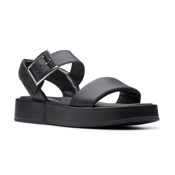 The Clarks Womens Alda Strap Black Leather sandal by CLARKS features a thick sole, Wide front strap, and adjustable ankle strap with silver buckle. Designed for comfort with a contour cushion footbed, shown from the front angle.
