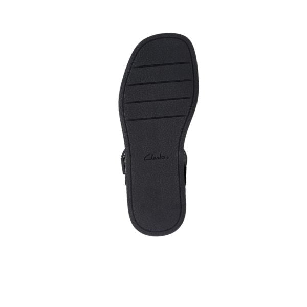 The image displays the black sole of the Clarks Womens Alda Strap Black Leather shoe, viewed from below. The sole has horizontal grooves and CLARKS printed in the center, emphasizing comfort. The background is white.