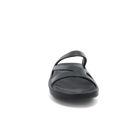The SOVELLA Sovella Women's PF Slide Black sandal features a front view with two straps and a textured footbed for comfortable cushioning, all shown against a plain light gray background.