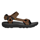The Teva Men’s Hydratrek Sandal in brown features open toes, adjustable nylon straps, orange accents, and a thick black sole with traction technology and textured pattern.